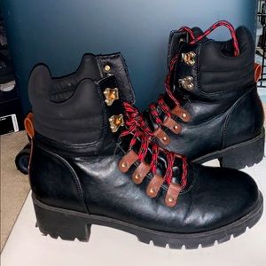 Black combat booties with red and black laces